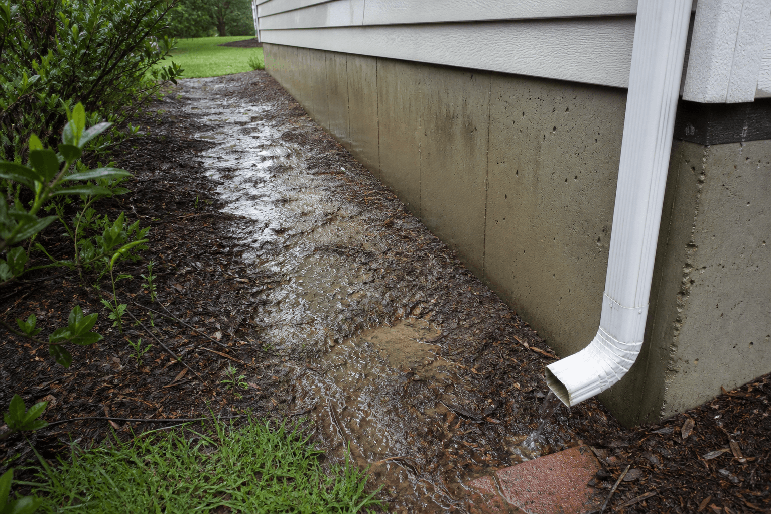 Saturated soil pressing against a below-grade foundation wall